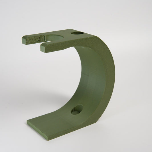 Green metal bracket on a white background