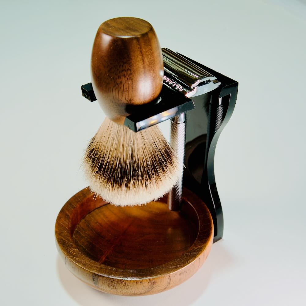Image of Stuga's Acrylic Noir Grooming Shaving Kit Stand, a sleek, handcrafted display for brush, razor, and bowl, promoting sustainability.