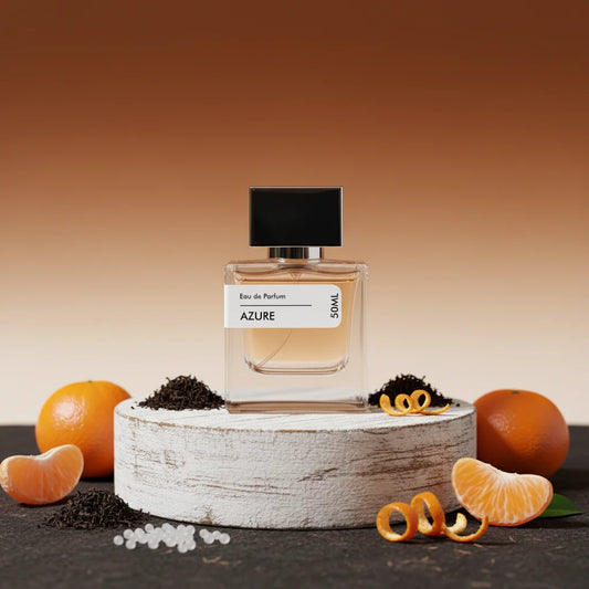Azure Eau de Parfum 50ml bottle with black cap, surrounded by fresh oranges, tangerine slices, and loose tea leaves.