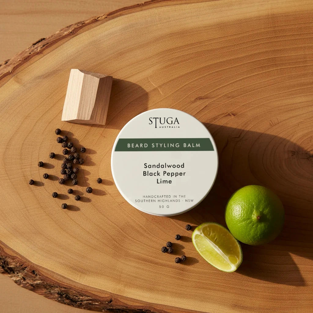 Stuga Australia Beard Styling Balm in Sandalwood Black Pepper Lime scent, 50g round white tin on wooden surface