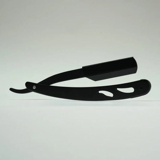 Black straight razor with cut-out handle design for precise shaving and grooming