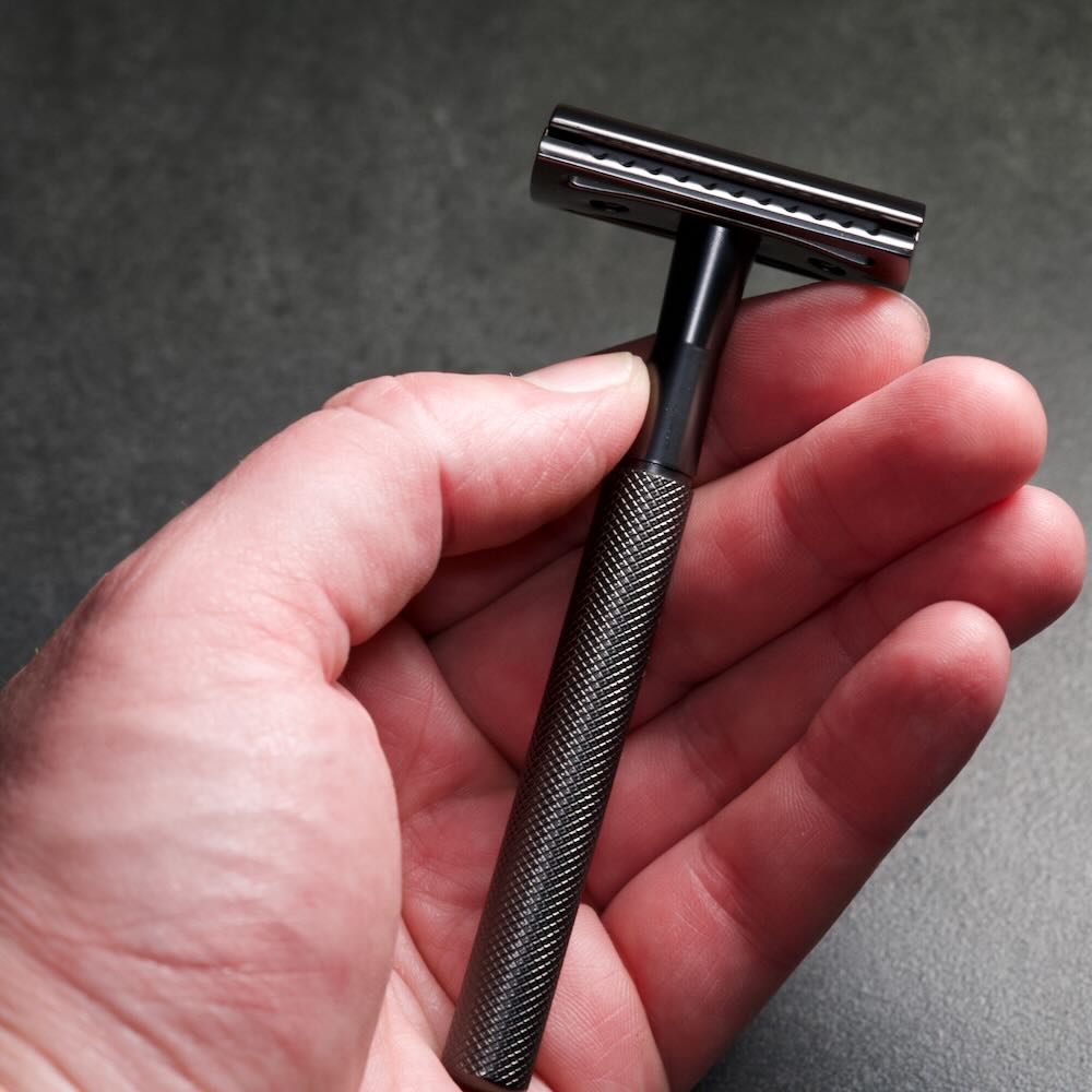 Image of Stuga's WÖLFE 97 double edge safety razor, showcasing its handcrafted design, balanced weight, and smooth blade exposure.