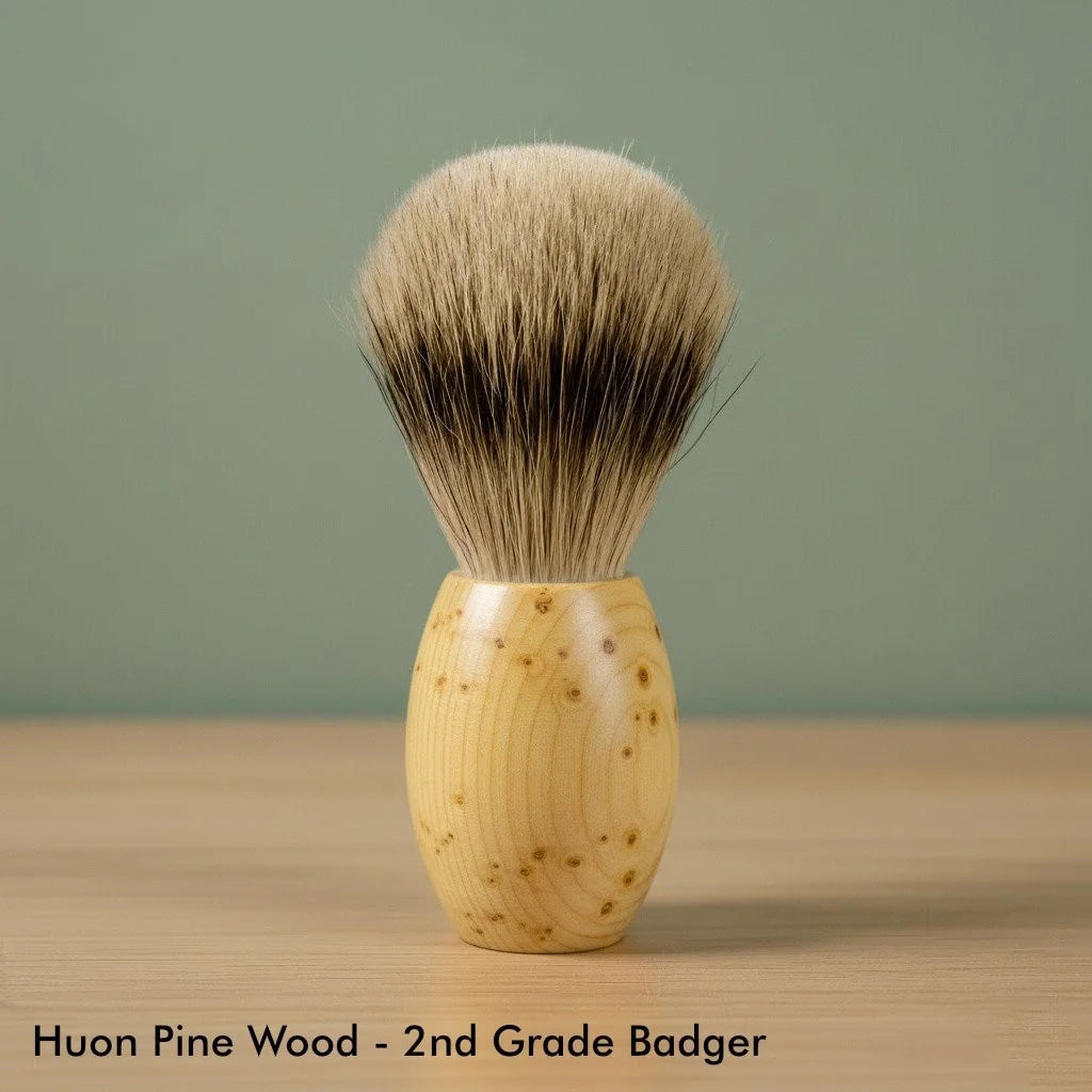 Huon pine wood handle shaving brush with 2nd grade badger bristles, light wood grain, for wet shaving.