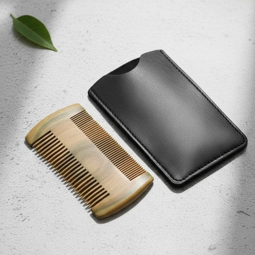 Handcrafted sandalwood beard comb with fine and coarse teeth, accompanied by a sleek black leather travel case.