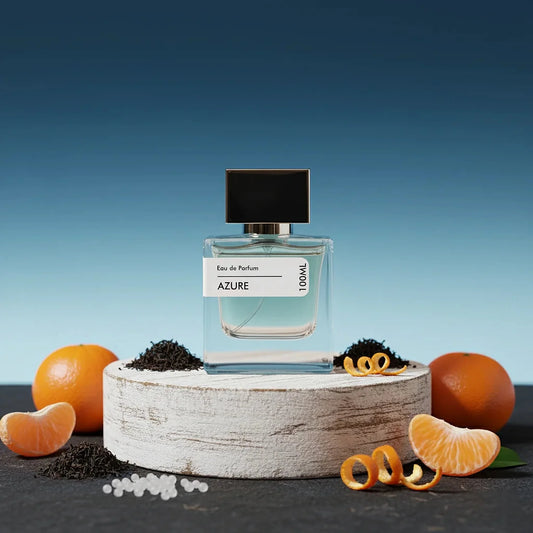 Stuga Azure Eau de Parfum, 100ml bottle with a black cap, surrounded by fresh oranges, tangerine slices, orange peels, and loose black tea leaves on a rustic wooden stand, against a blue background.