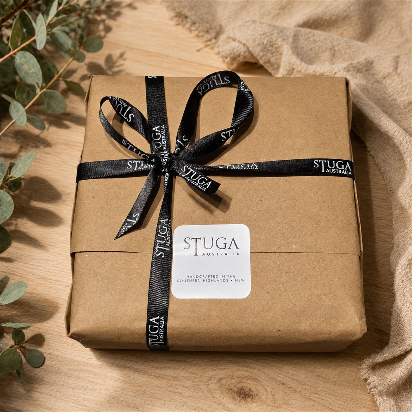 Stuga gift wrapping - kraft paper parcel tied with black Stuga Australia ribbon, handcrafted in the Southern Highlands NSW