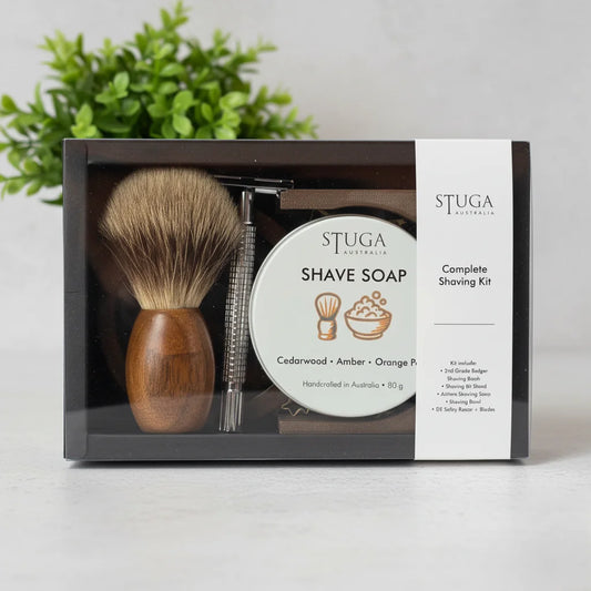 Stuga complete shaving kit with badger brush, safety razor, and cedarwood amber orange peel shave soap.