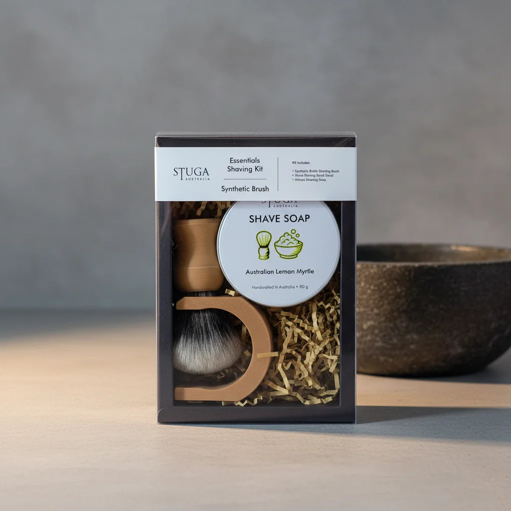 Stuga Essentials Shaving Kit with synthetic brush, wooden stand, and Australian Lemon Myrtle shave soap in clear packaging.
