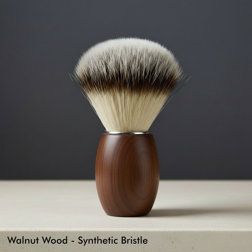 Close-up of a premium shaving brush with a dark walnut wood handle and soft, two-toned synthetic bristles.