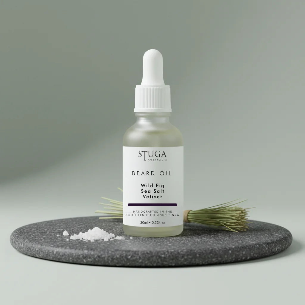 Stuga Australia beard oil 30ml dropper bottle in wild fig, sea salt, and vetiver scent on stone display