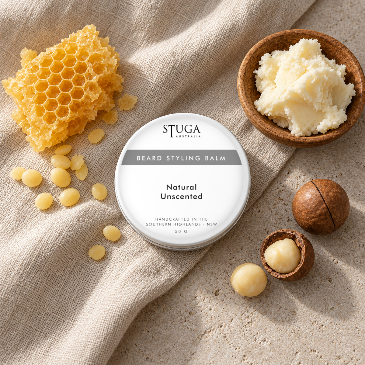 Stuga Beard Styling Balm in Natural Unscented — 50g white tin on natural linen with beeswax honeycomb and pellets, raw shea butter and macadamia nuts. Fragrance-free natural hold beard balm handcrafted in the Southern Highlands, NSW Australia.