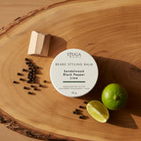 Stuga Australia Beard Styling Balm in Sandalwood Black Pepper Lime scent, 50g round white tin on wooden surface