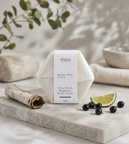 Stuga Australia Beard Wash Block, natural shampoo bar scented with silver birch, bergamot and forest cassis, 100g, with eucalyptus and blackcurrants on a stone slab.