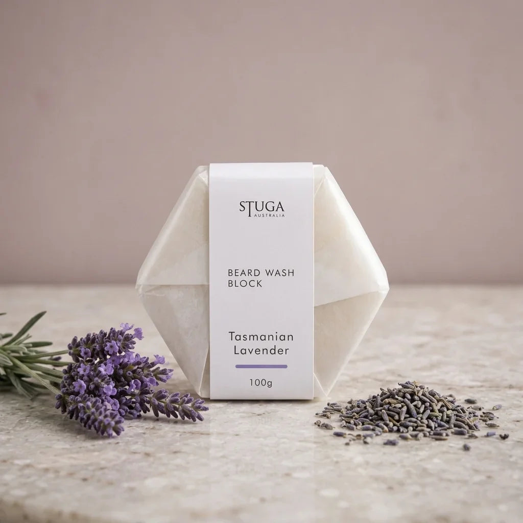 Stuga Australia Beard Wash Block, natural shampoo bar scented with Tasmanian lavender, 100g, with fresh and dried lavender on a stone benchtop.