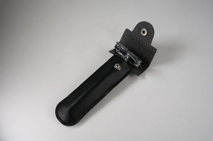 Black leather razor holder with snap closure and metal clip for secure storage and travel protection
