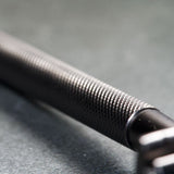 WÖLFE 97 double edge safety razor in matte black, side profile showing the slim handle.