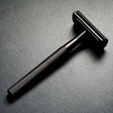 WÖLFE 97 three-piece double edge safety razor in matte black, balanced weight for a controlled, comfortable shave.