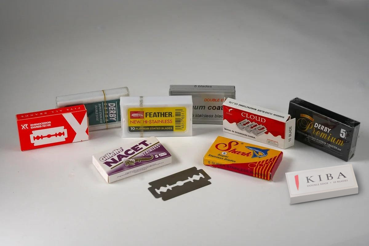 Double edge razor blade packs from assorted brands, including Kiba, with a loose DE blade