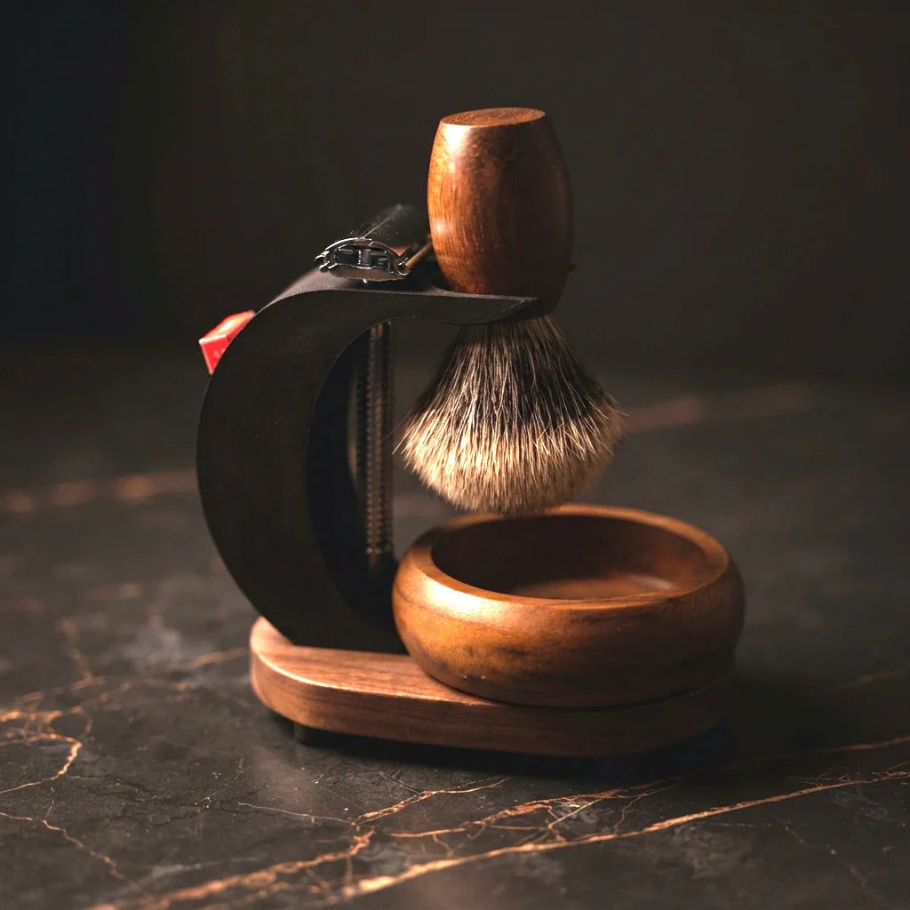 The Grand Wave timber shaving stand holding a safety razor, silver-tip badger shaving brush and wooden lather bowl — a complete wet shaving set handmade in Australia by Stuga