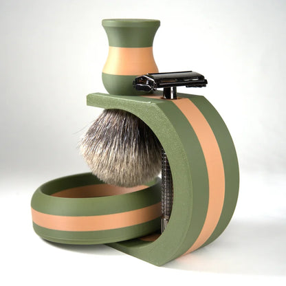Green and peach striped shaving set with badger hair brush, safety razor, and matching bowl for wet shaving