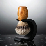 Heartwood Huon pine silvertip badger shaving brush on a matte black Wave stand, hand-turned in Moss Vale by Stuga