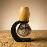Huon pine handle Premium badger bristle shaving brush on a matte black Wave stand, Australian made by Stuga.