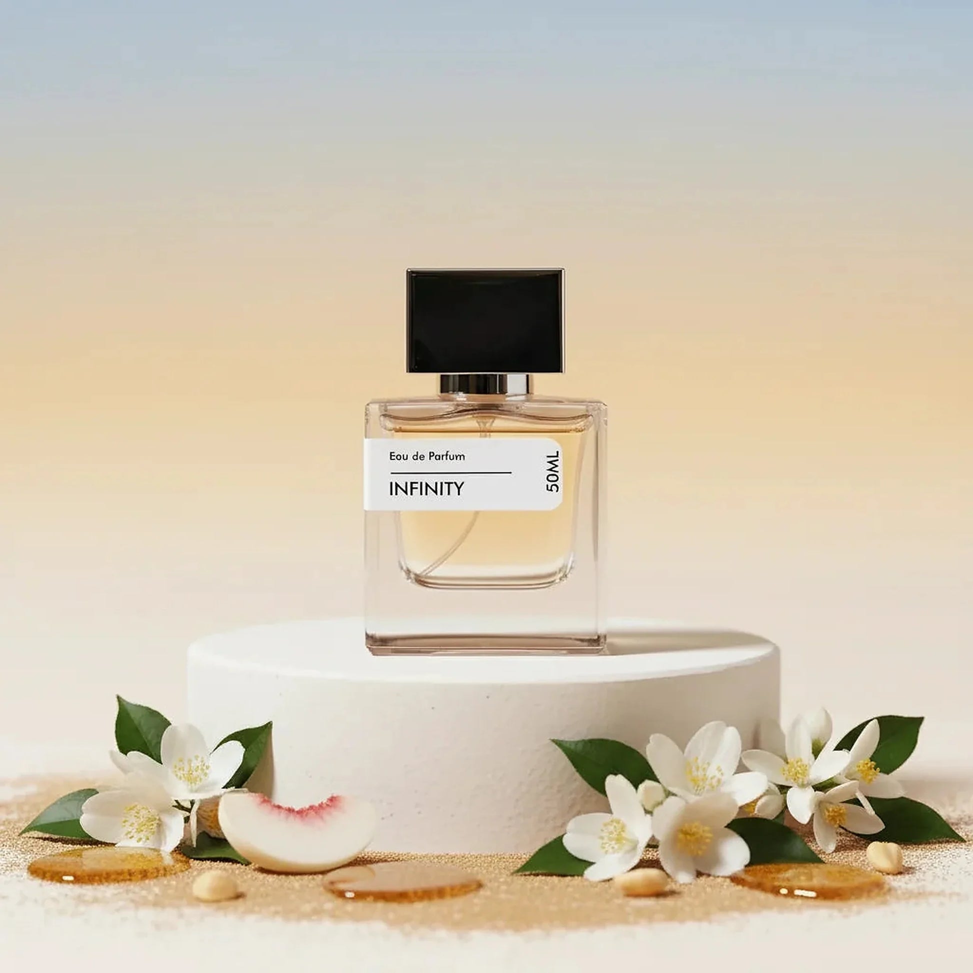 Infinity Eau de Parfum 50ml bottle with black cap, surrounded by white jasmine flowers and peach slices on a white pedestal.