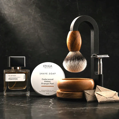 Luxury Magic Shaving Kit with matched 30ml Phantom eau de parfum, STUGA shave soap tin, silver tip badger brush, timber bowl, safety razor and wrapped blades on black marble