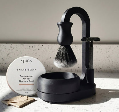 Stuga matte black shaving set with safety razor, brush, stand, bowl, and cedarwood amber shave soap tin