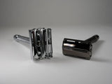 Two chrome metal double edge safety razors with textured handles for precise shaving