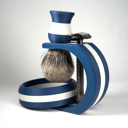 Navy blue and white striped shaving set with badger hair brush, safety razor, and matching bowl