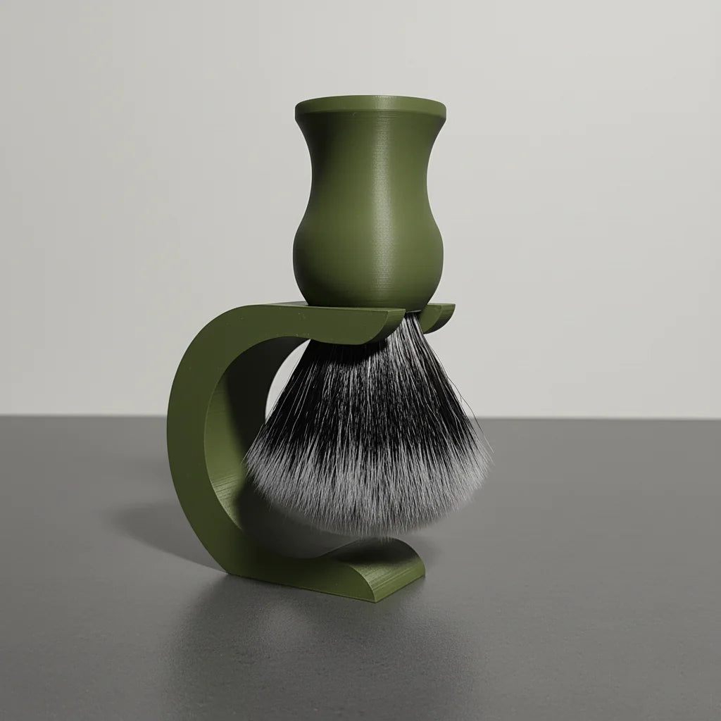 Olive green shaving brush with black and white synthetic bristles, resting on a matching olive green stand.