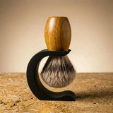 Premium badger shaving brush with handturned teak wood handle on the Stuga Wave stand