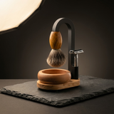 Premium wooden shaving kit in olive wood with suspended badger brush, timber bowl and safety razor