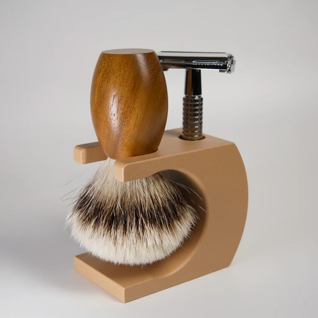 Shaving brush and safety razor on a wooden stand against a white background