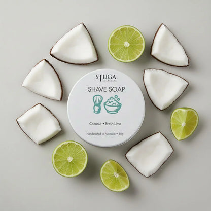 Stuga Australia shave soap with coconut and fresh lime, handcrafted, 80g, surrounded by coconut pieces and lime halves.