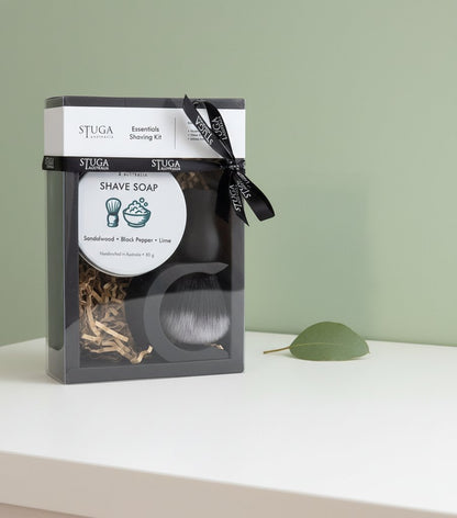 Stuga Essentials Shaving Kit with sandalwood, black pepper, and lime shave soap, brush, and bowl in clear packaging.