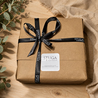 Stuga parcel wrapped in kraft paper and ribbon