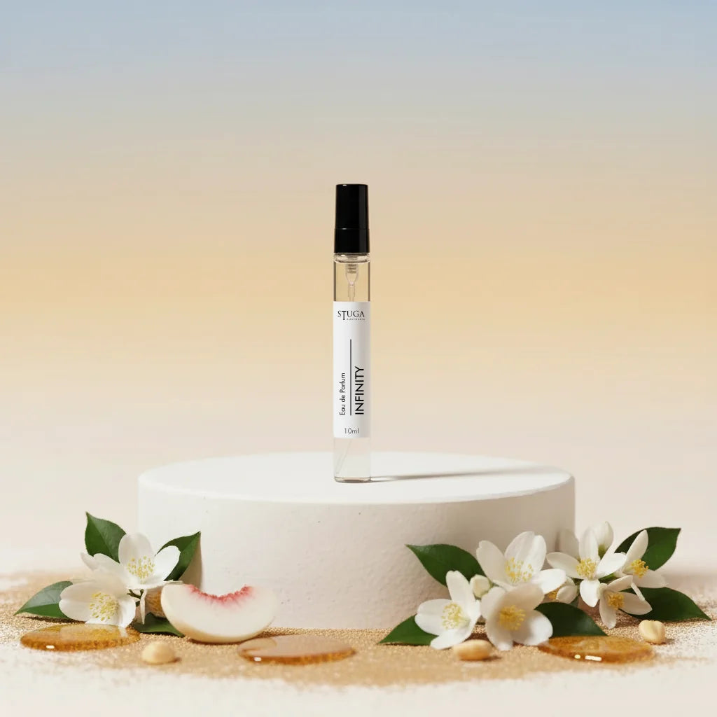 Stuga Infinity Eau de Parfum 10ml travel spray bottle with jasmine flowers and peach slice