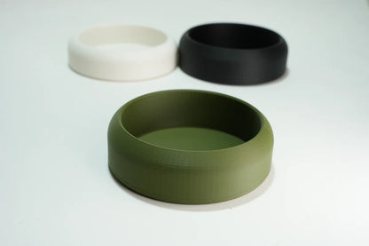 Set of three round 3d printed  lathering bowls in olive green, black, and white colors for shaving