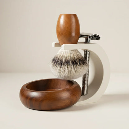 Stuga complete shaving kit with wooden bowl, brush, and razor on a white stand.