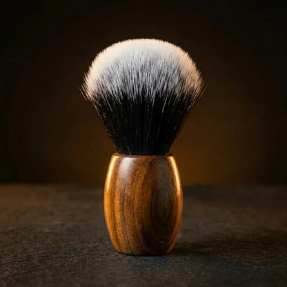 Synthetic shaving brush with dark-to-white gradient bristles and a polished teak wood handle