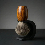 Teak wood handle Essentials badger bristle shaving brush on a matte black Wave stand, Australian made by Stuga.