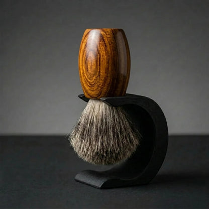 Teak wood handle Essentials badger bristle shaving brush on a matte black Wave stand, Australian made by Stuga.