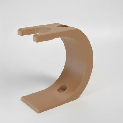 Brown plastic bracket on a white background