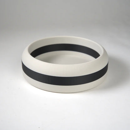 White ceramic bowl with a wide black horizontal stripe around the exterior, ideal for serving or decoration