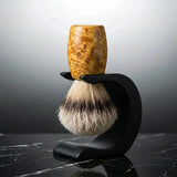 Heartwood Huon pine silvertip badger shaving brush on a matte black Wave stand, handmade by Stuga